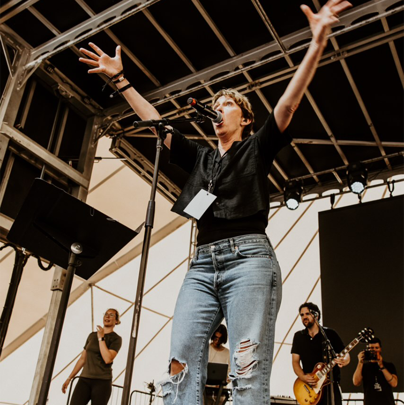 Suzy Yaraei with Raised Hands 